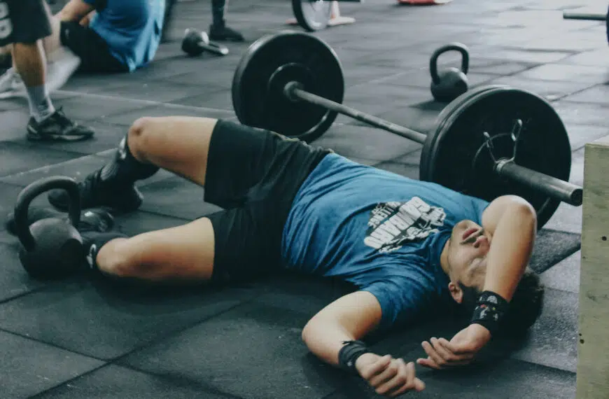 weight lifter lays on floor injured