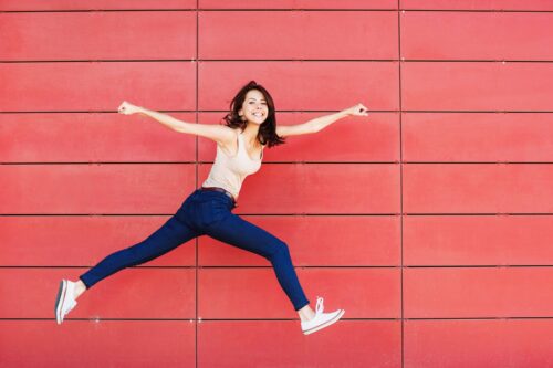 woman in long stride smiling scaled