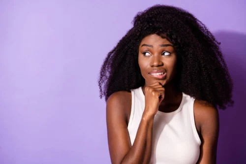 woman looks to be thinking scaled