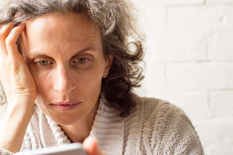 woman with hand on side of face looking stressed scaled