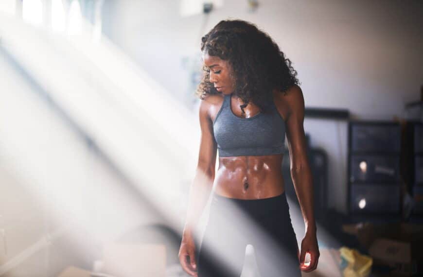 young fit woman stands in position scaled