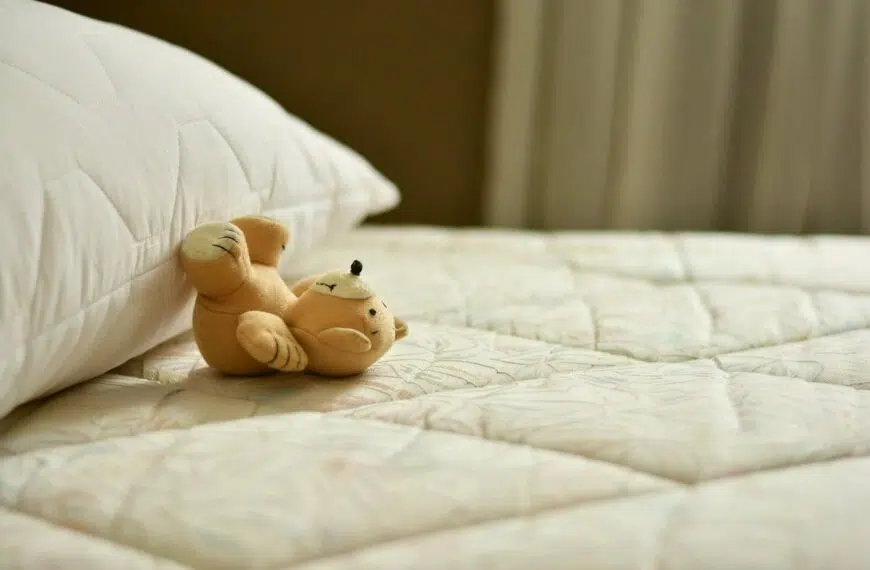 small teddy bear on mattress
