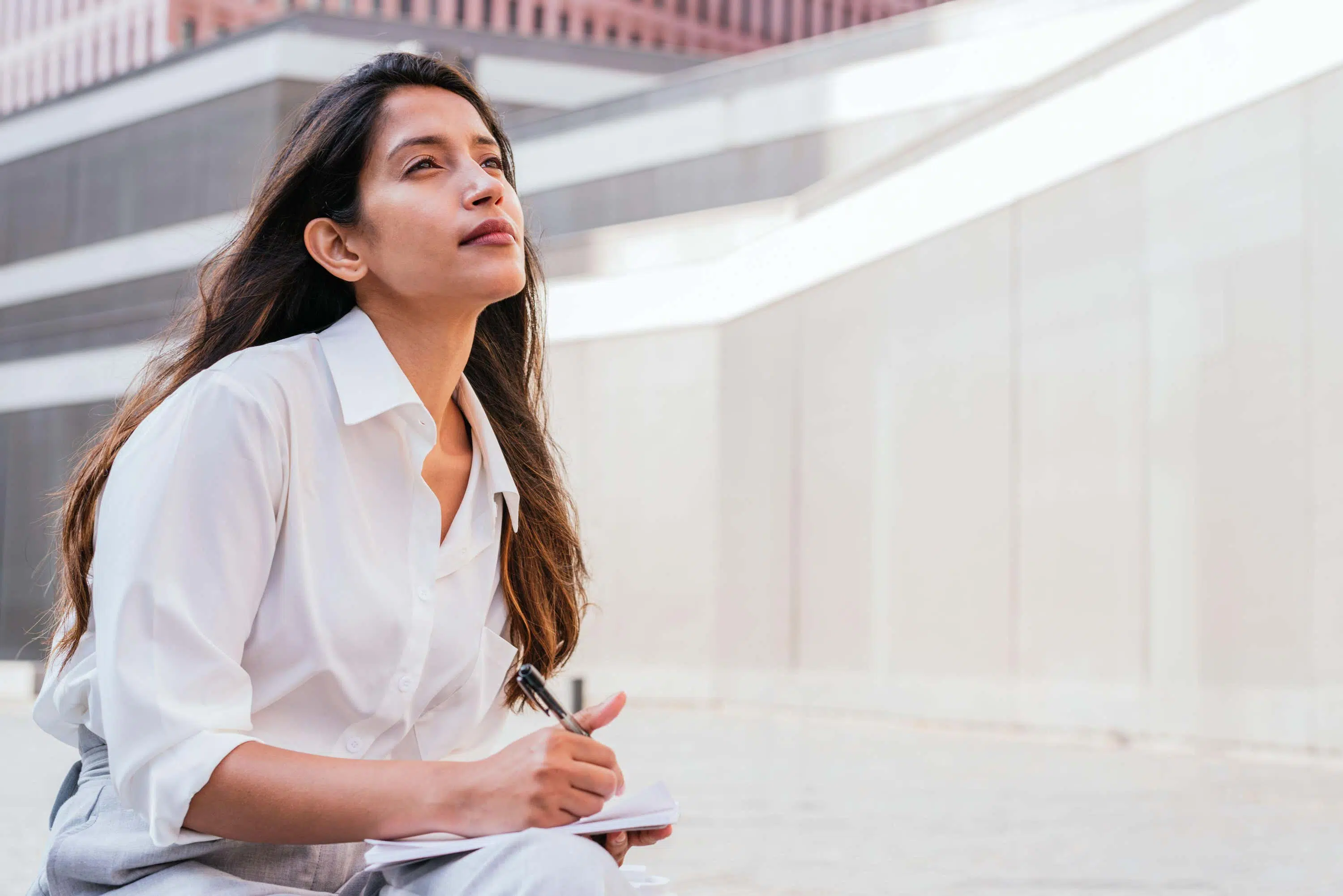 Woman looks blankly into the air scaled