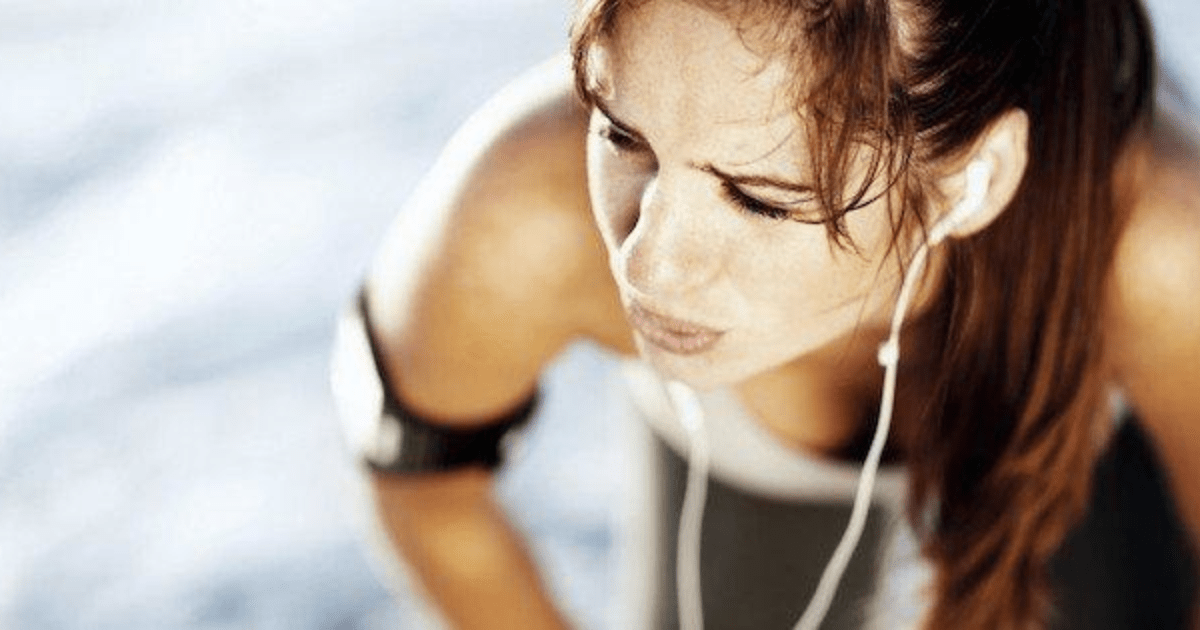 Woman pauses for breath after exercise