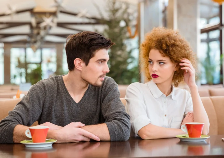 young couple look at each other in distain scaled