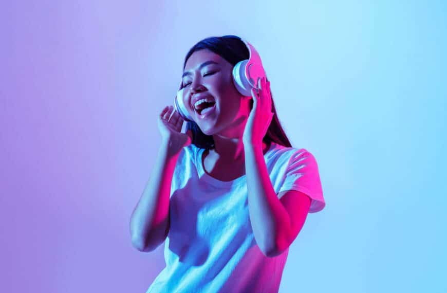 young girl with headphones on scaled