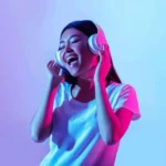 young girl with headphones on scaled