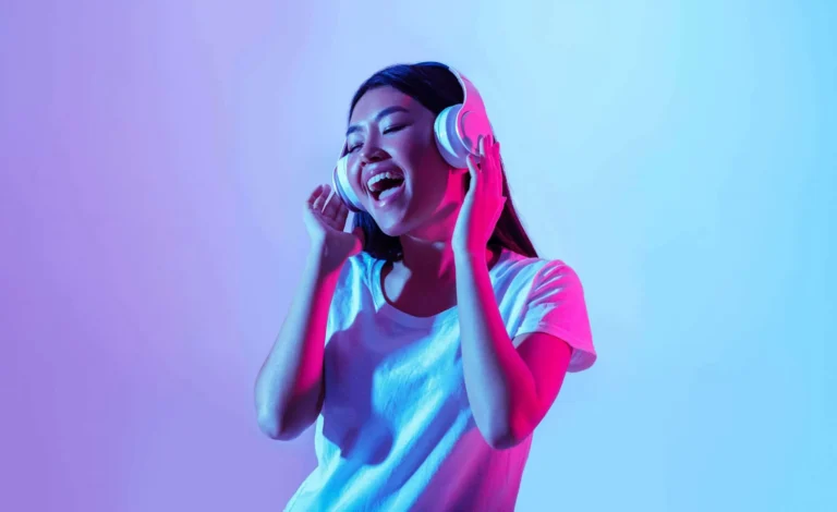 young girl with headphones on scaled