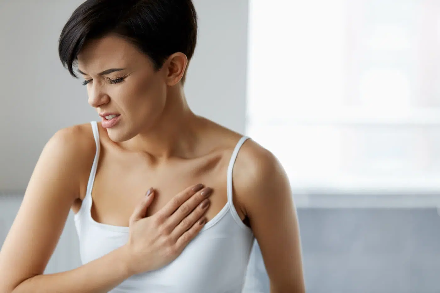 Woman feeling pain in chest. Health care