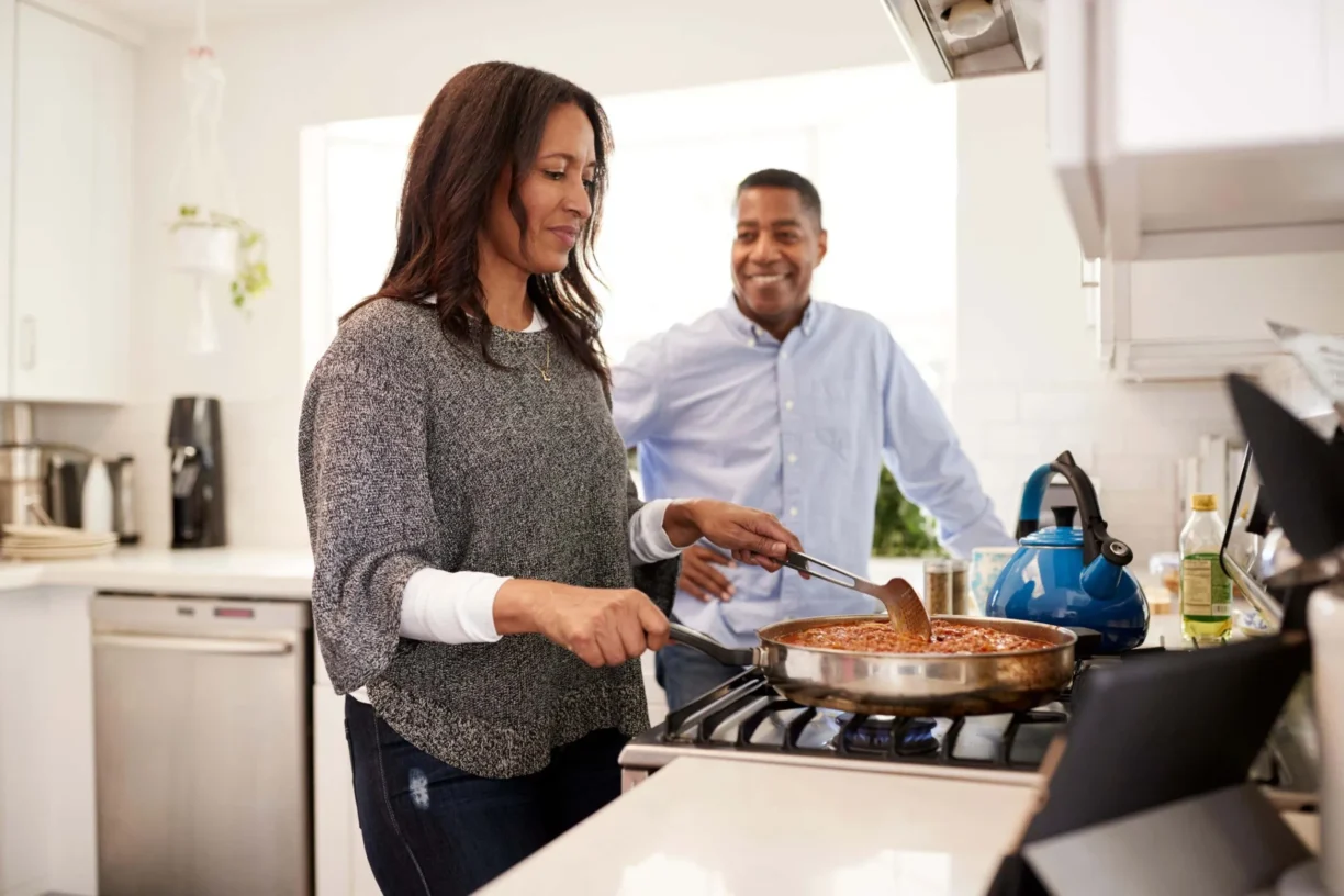 couple cook in kitchen