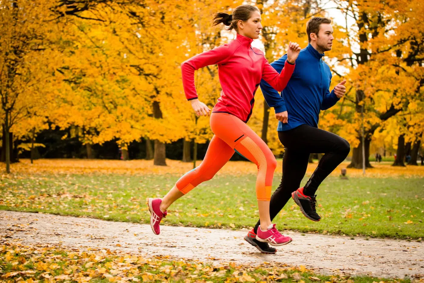 Couple running in autumn