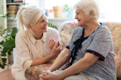 mother and daughter smile lovingly at each other scaled