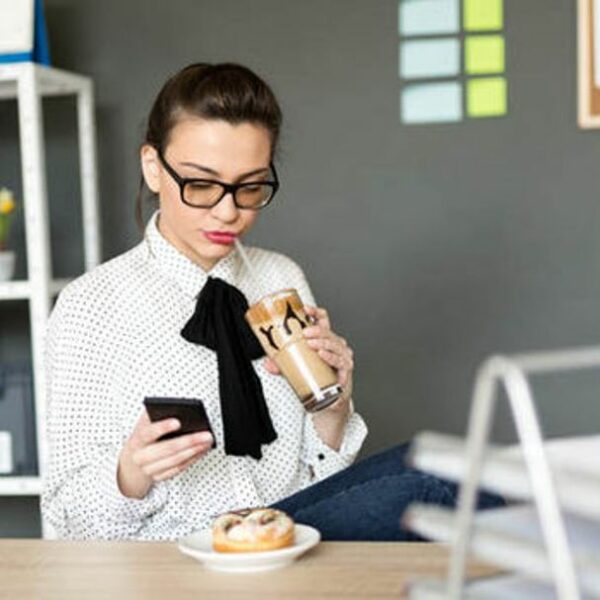 office worker eats at desk