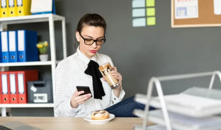 office worker eats at desk