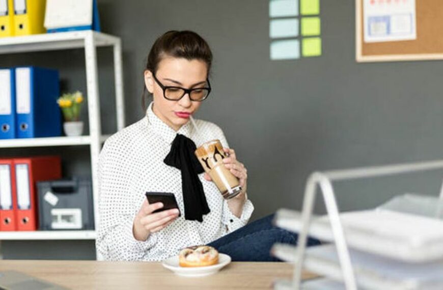 office worker eats at desk