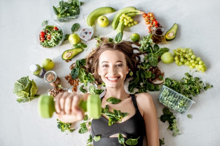 sports woman surrounded by various healthy food lying on the floor