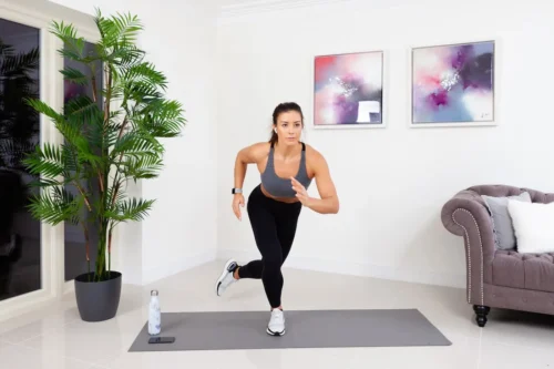 woman exercising on yoga mat
