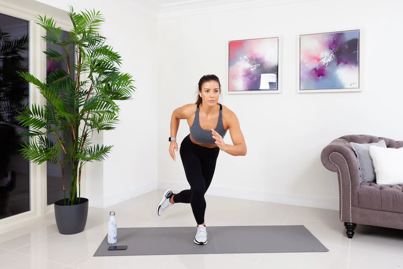 woman exercising on yoga mat