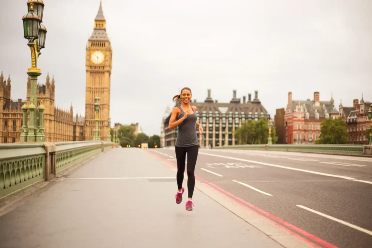 woman running across westminster bridge