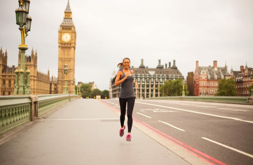 woman running across westminster bridge