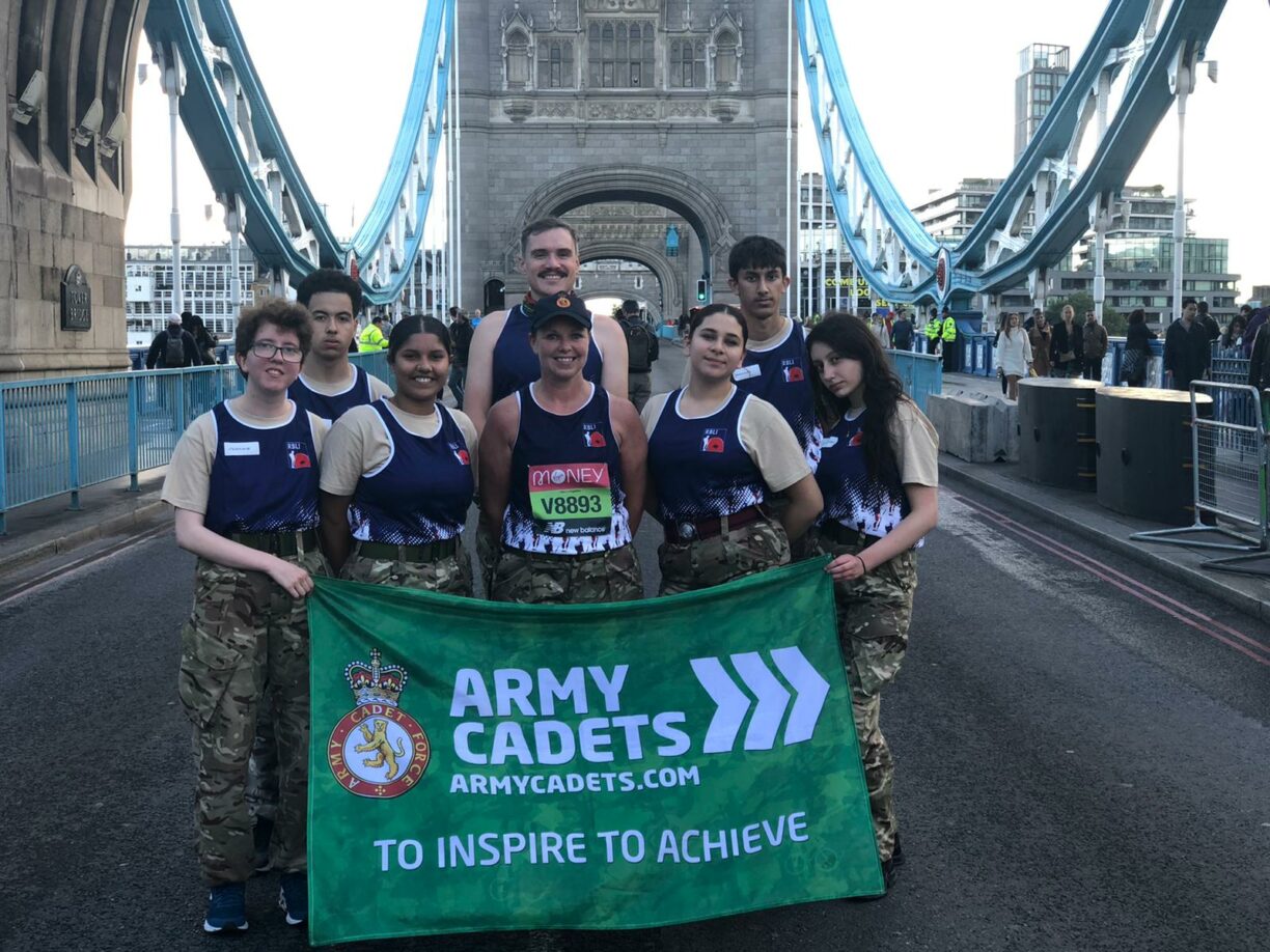 Army cadets national ambassador sally orange and cadets from city of london and north east sector acf at the end of the tower of london marathon