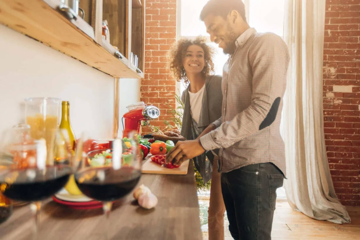 couple cook in kitchen