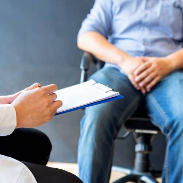 man sits with dr
