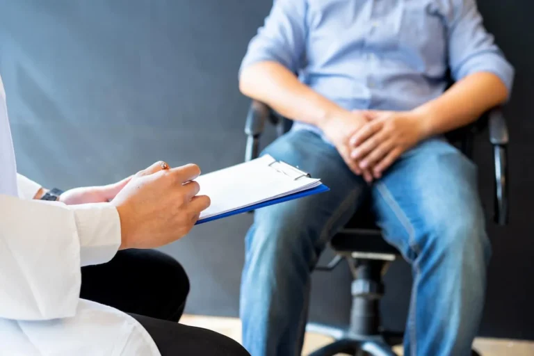 man sits with dr