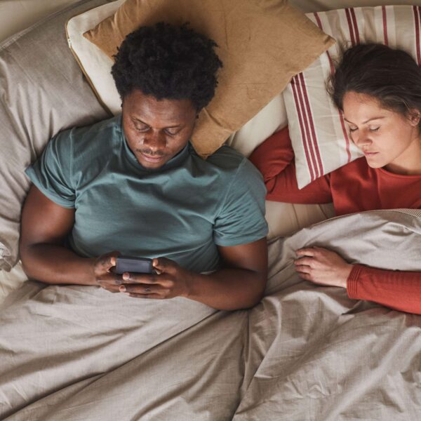 couple laying in bed not sleeping