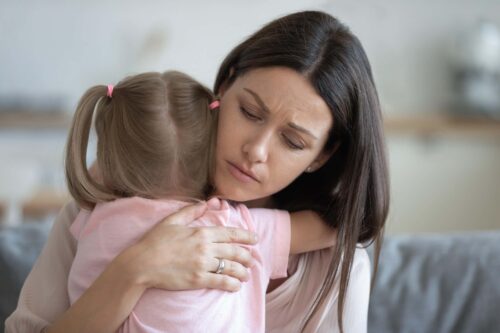 mother hugs child scaled