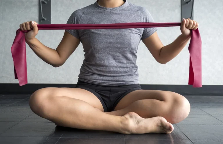 woman sits cross legged