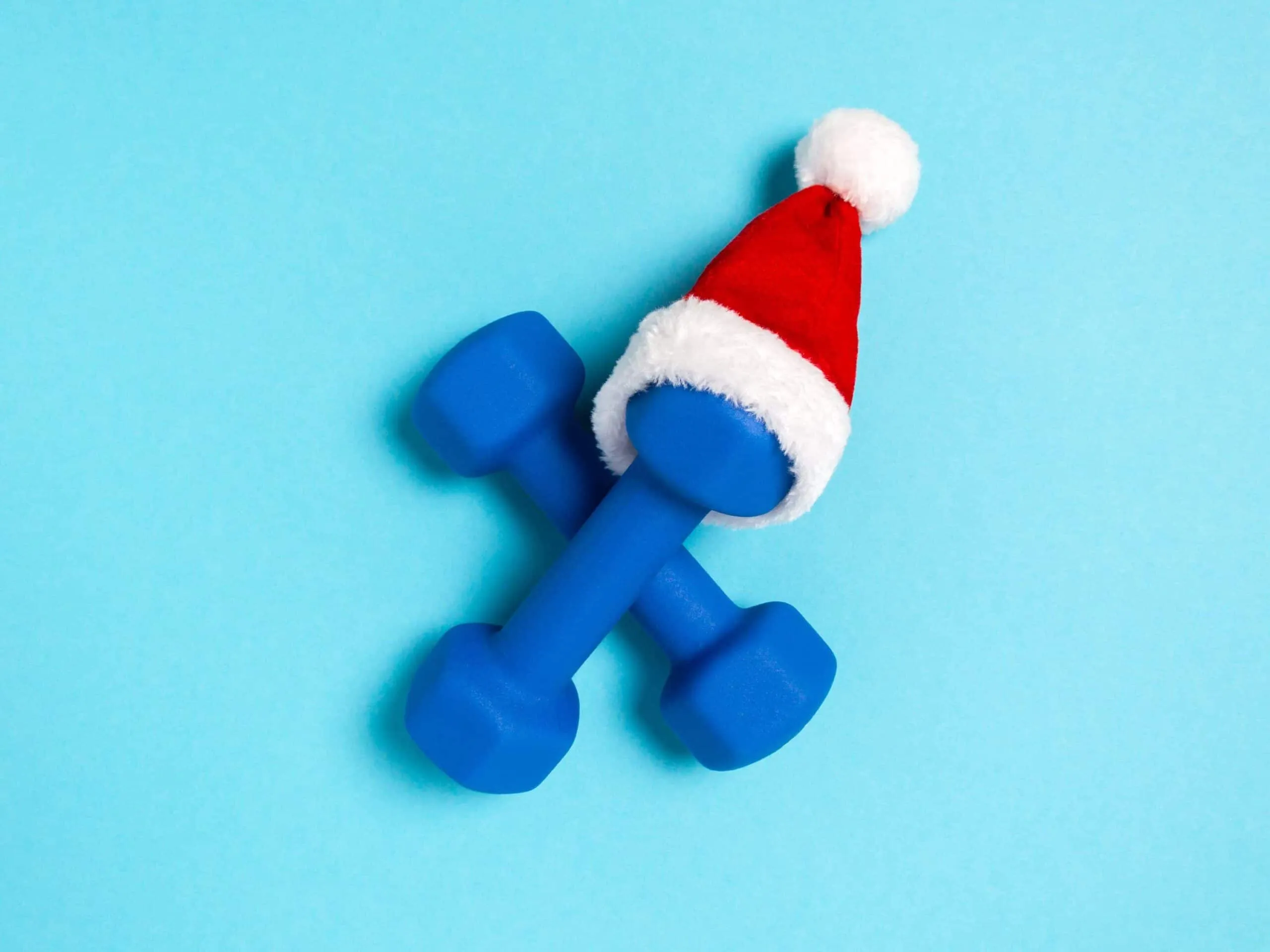 dumbbells with christmas hat on scaled