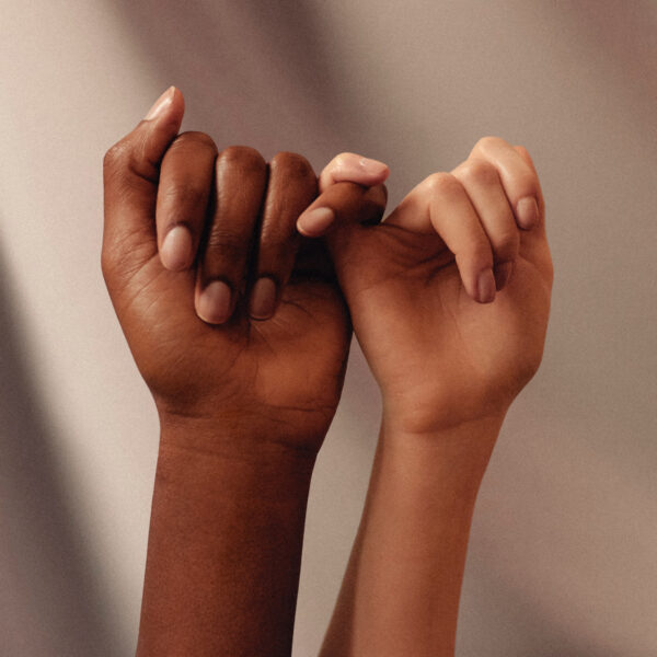 hands held together with fingers