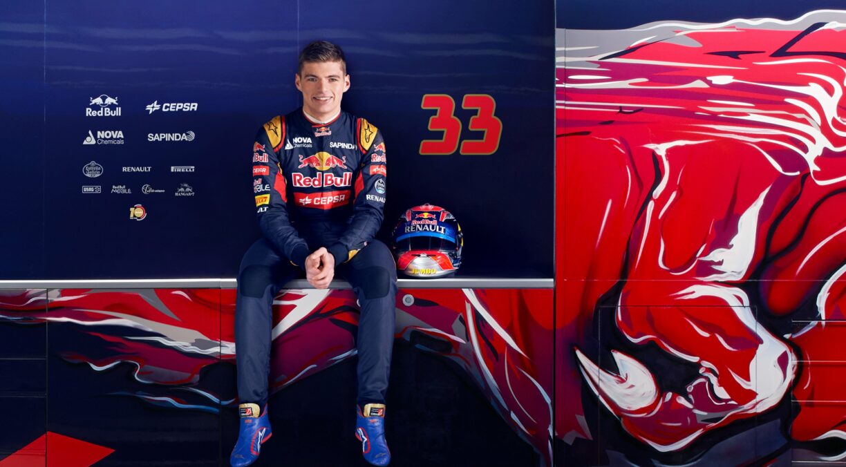 max verstappen with his red bull car