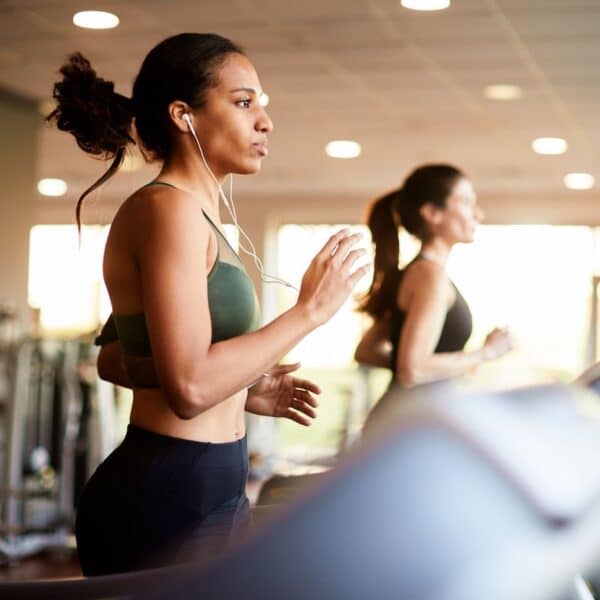 women run on treadmills