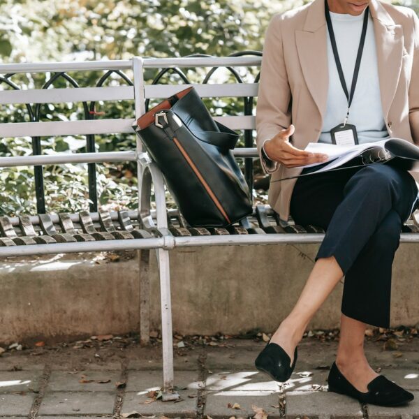 worker eats lunch on the bench