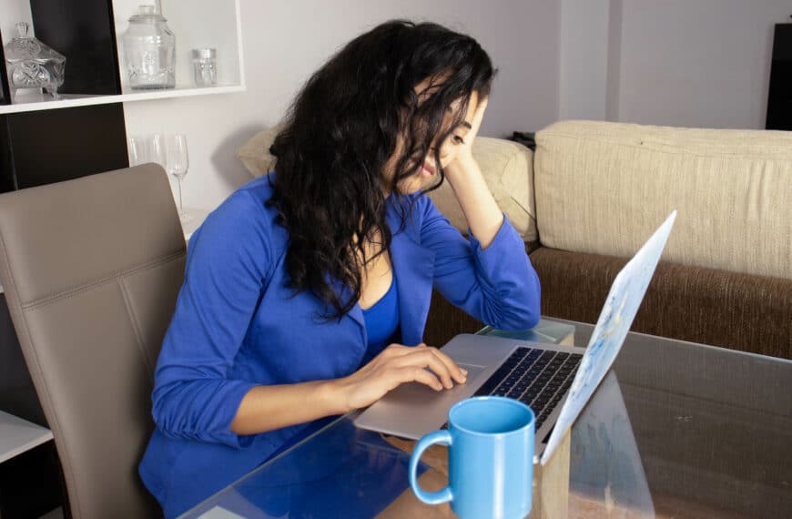 A depressed executive reading the reports of her work group