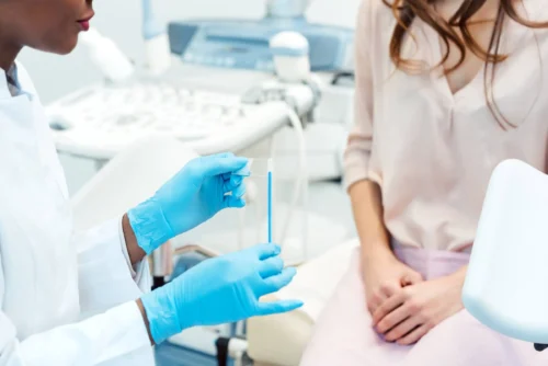 Woman seeing gynecologist doctor to check for health issue