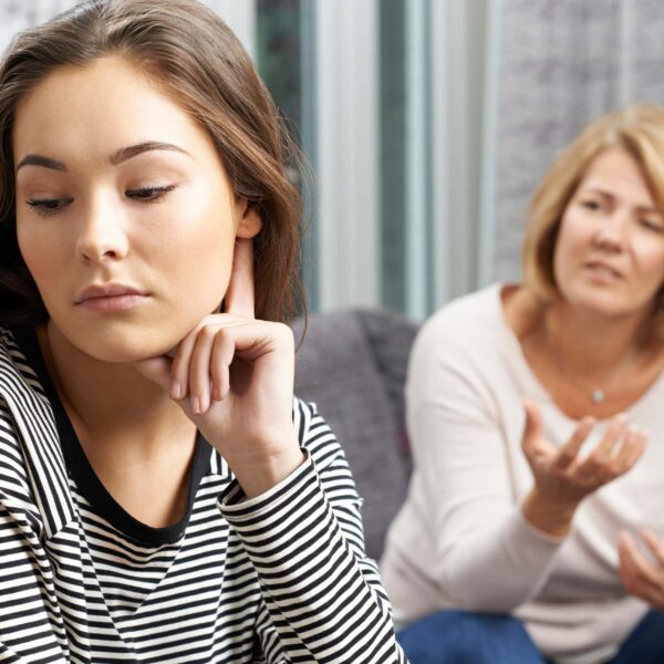 teen looks away from mum in disgust