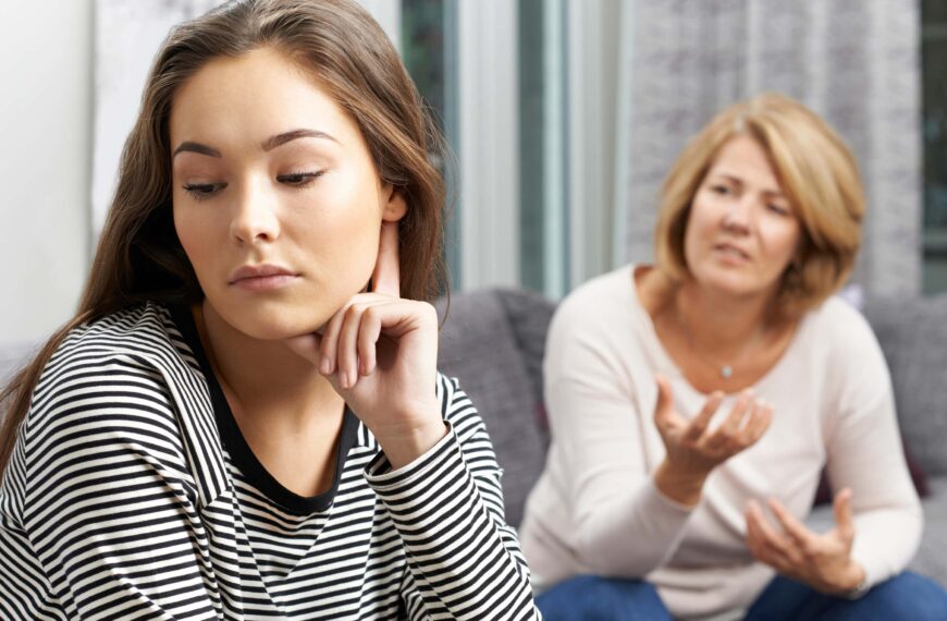 teen looks away from mum in disgust