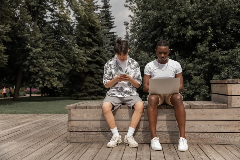 young people on tech outdoors