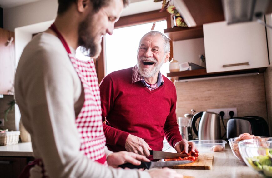 older and younger men share a laugh together scaled