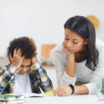 parent and child look over school books