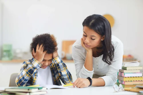parent and child look over school books