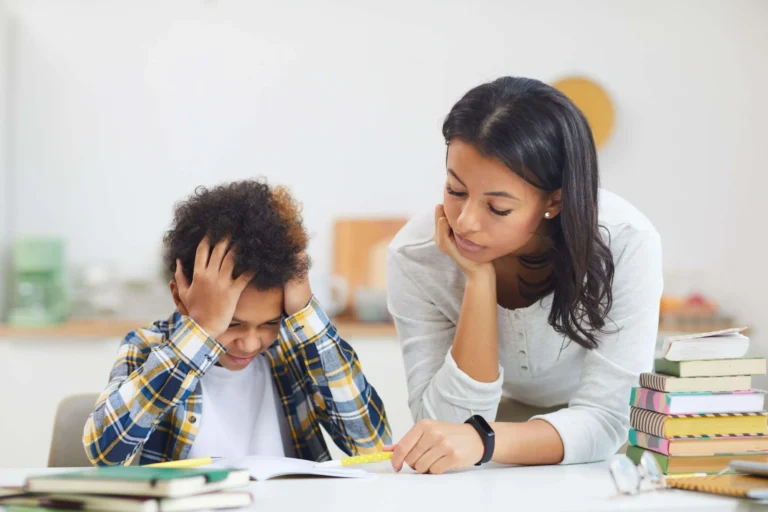 parent and child look over school books
