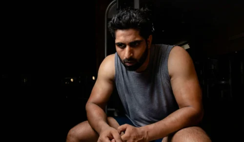 sleeveless shirted man scaled e1646052502251