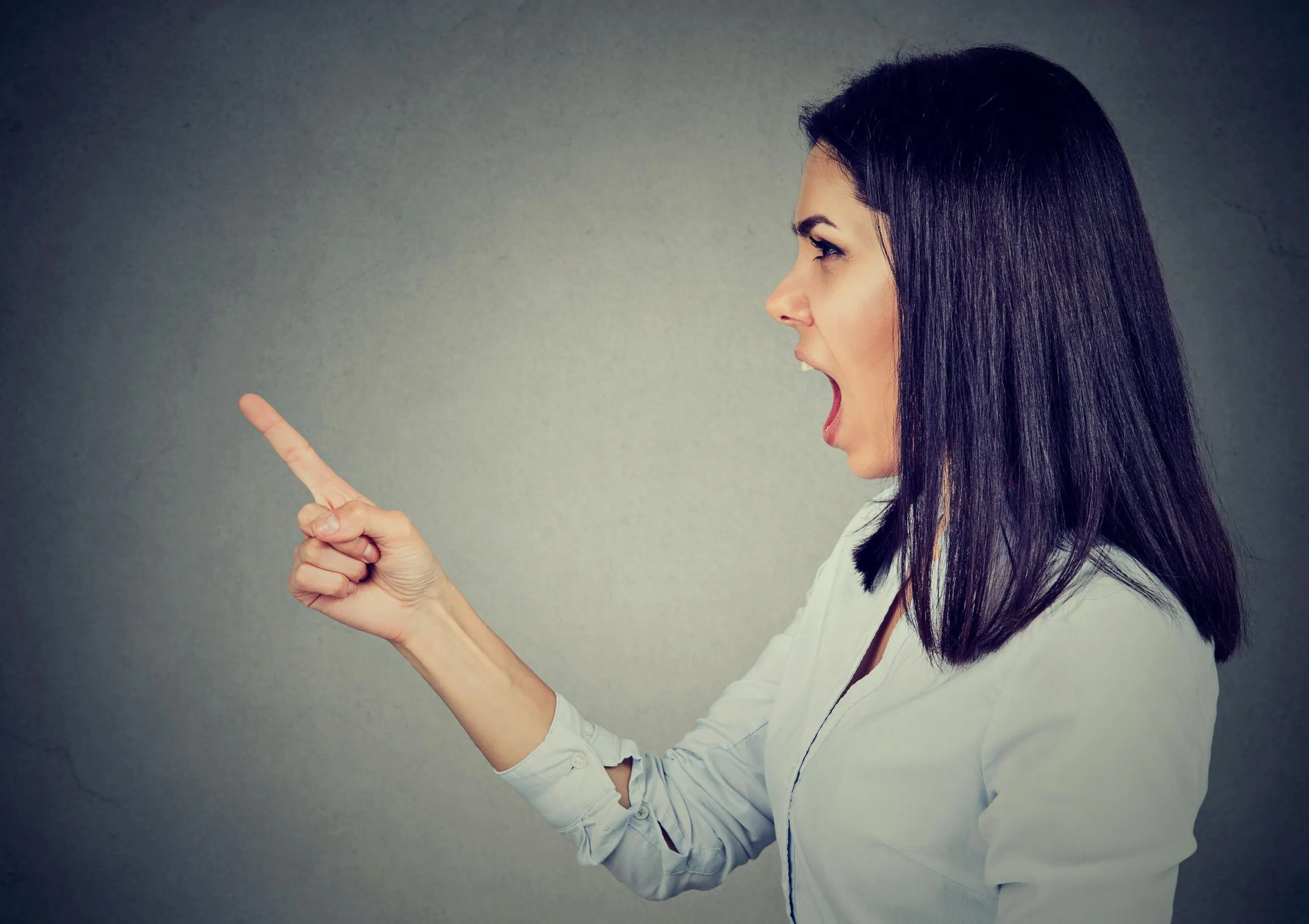 woman shouting and pointing scaled