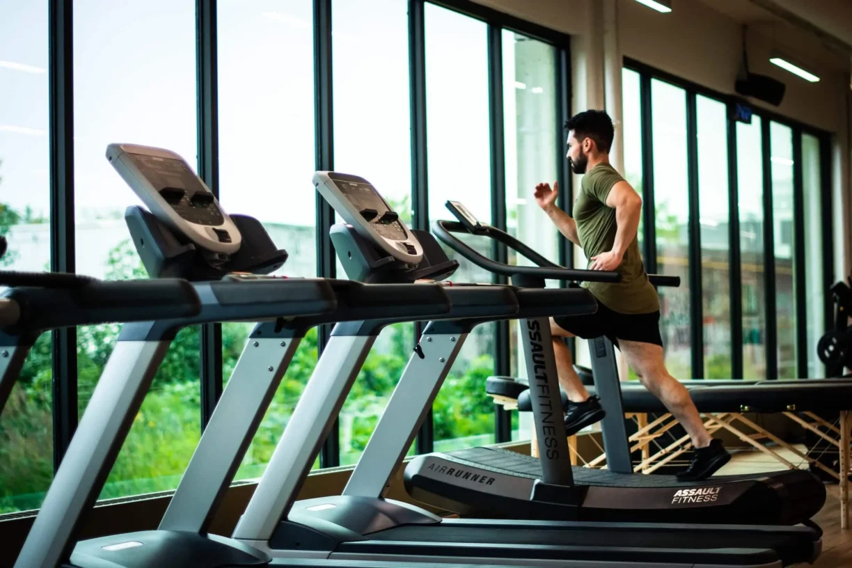 young man runs on treadmill