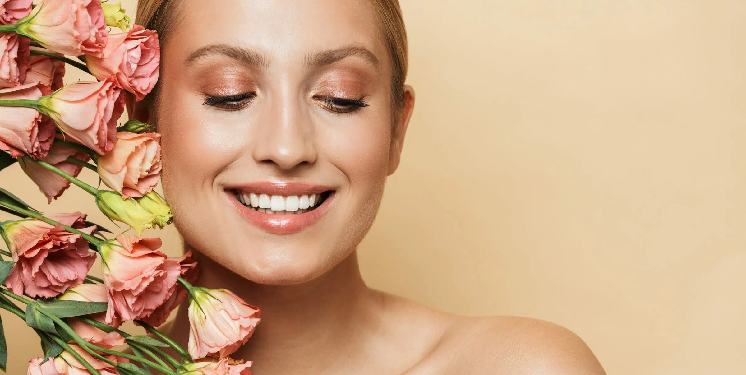 Blonde woman with flowers e1647874403344