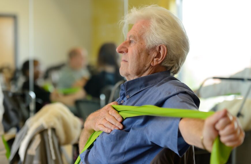mature man stretches Exercise band